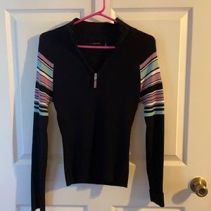 Daisy Fuentes black sweater with purple and teal on the sleeves